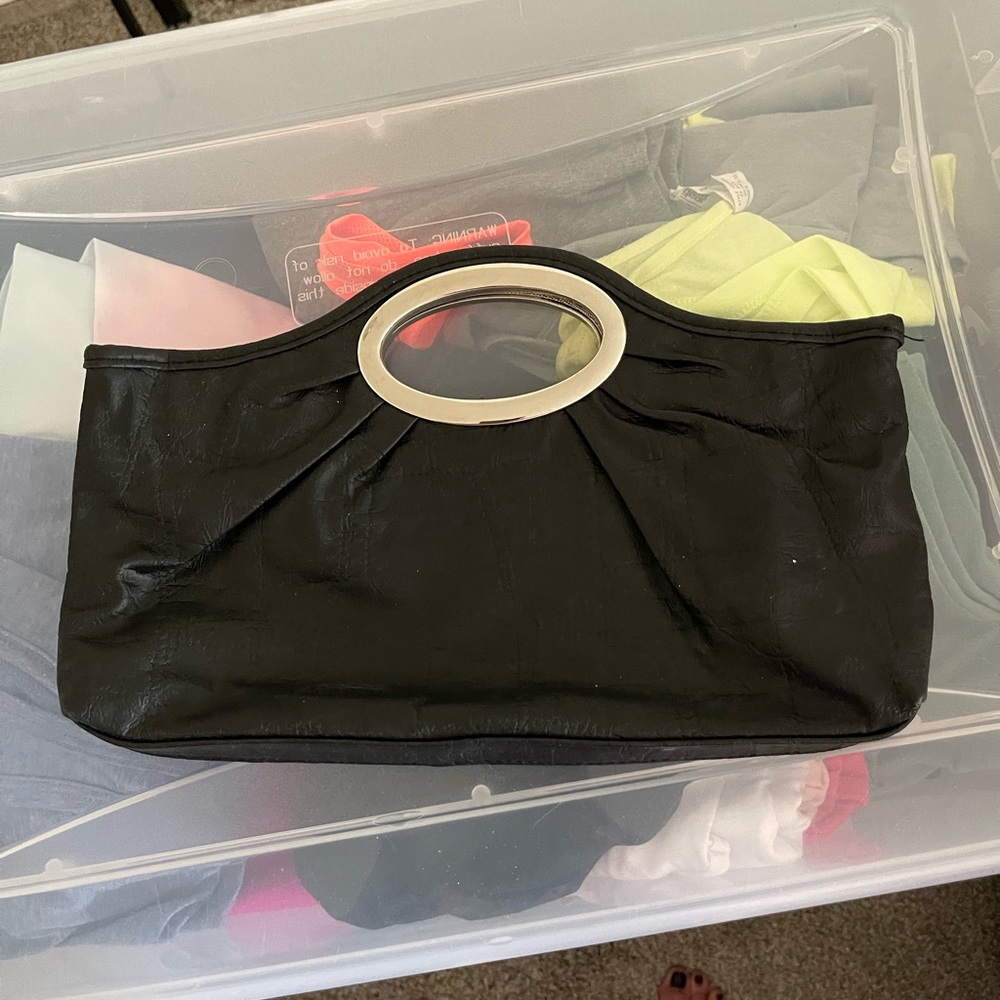 Black clutch bag with silver handles..